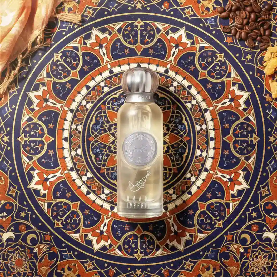 'Omani Imperial' Perfume bottle on a decorative patterned surface with coffee beans and wood by Gissah