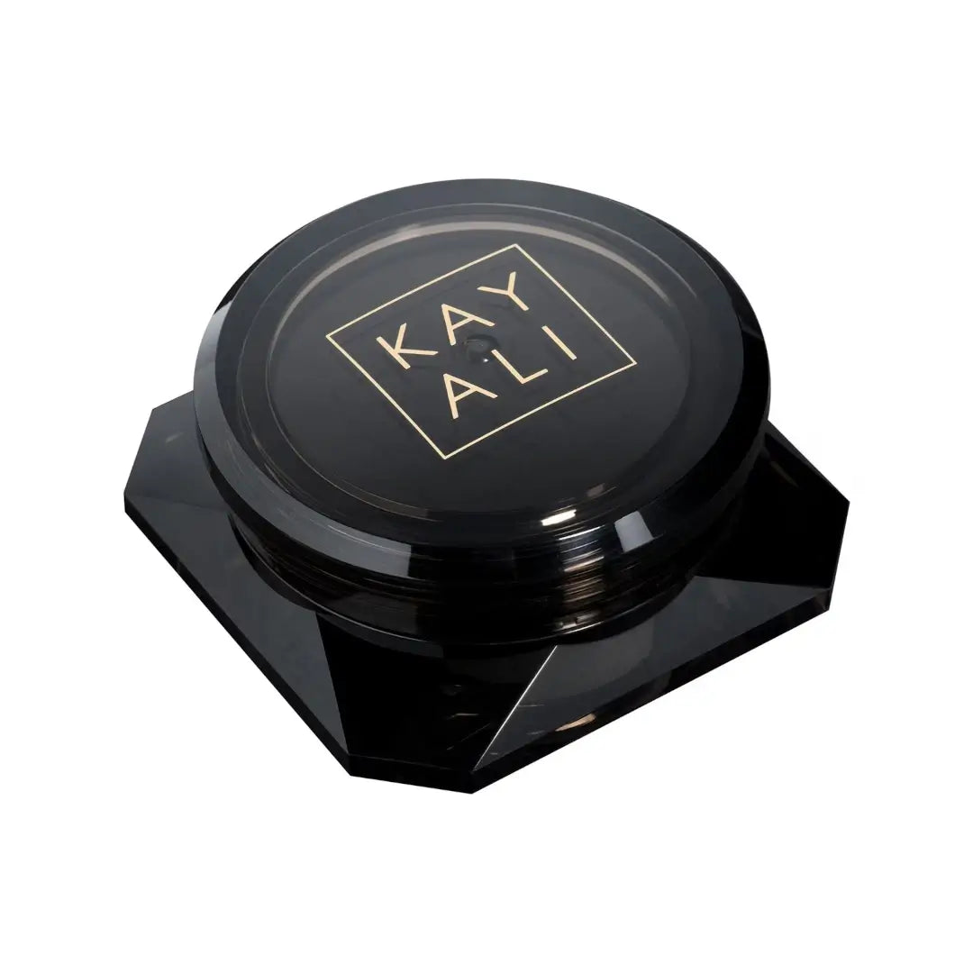 Oudgasm Vanilla Oud Perfumed Oud Wood container with lid featuring a Kayali logo on a white background