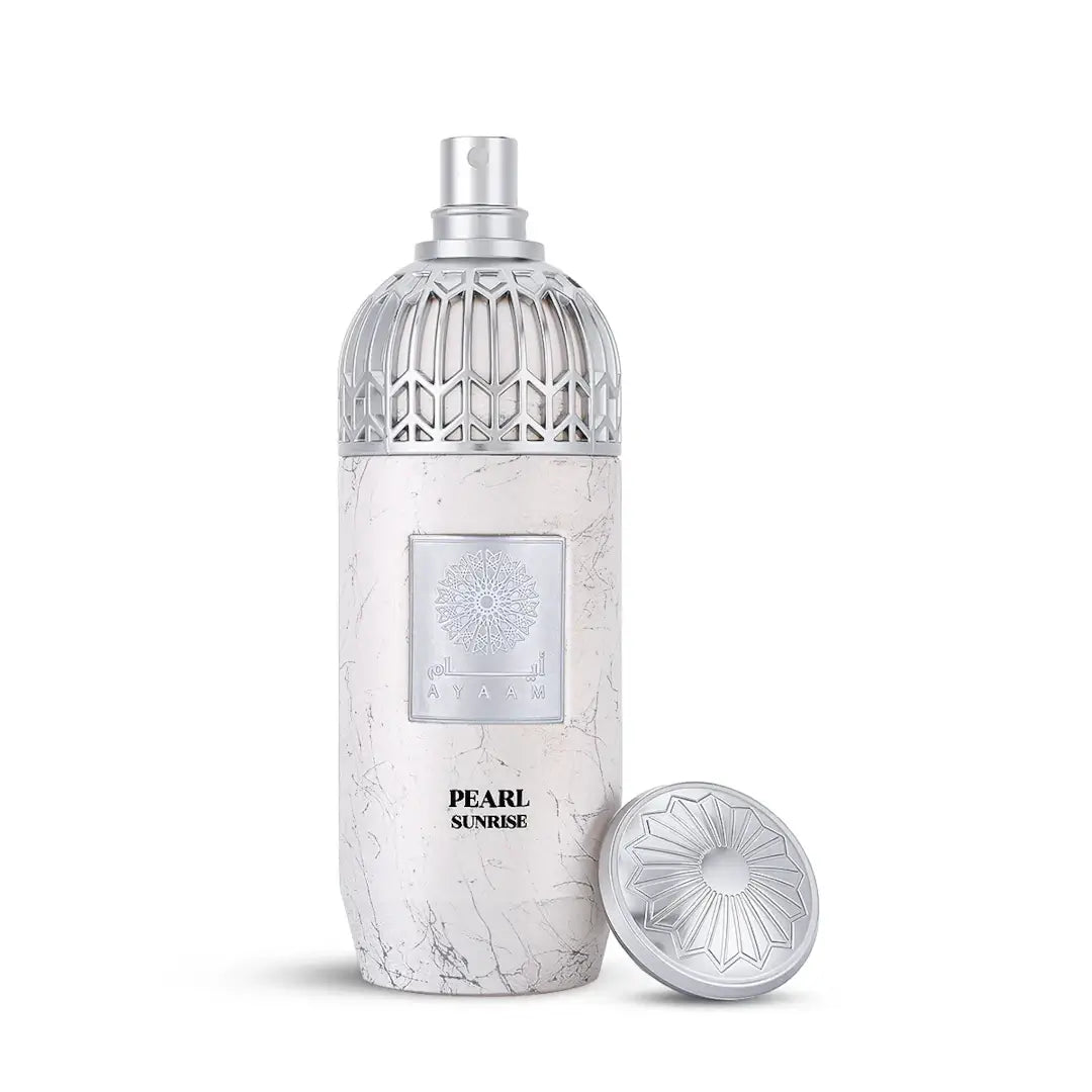 Perfume bottle labeled 'Pearl Sunrise' with a decorative cap on a white background with 'Ayaam' branding