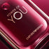 Red Emporio Armani perfume bottle with 'Power of You' label