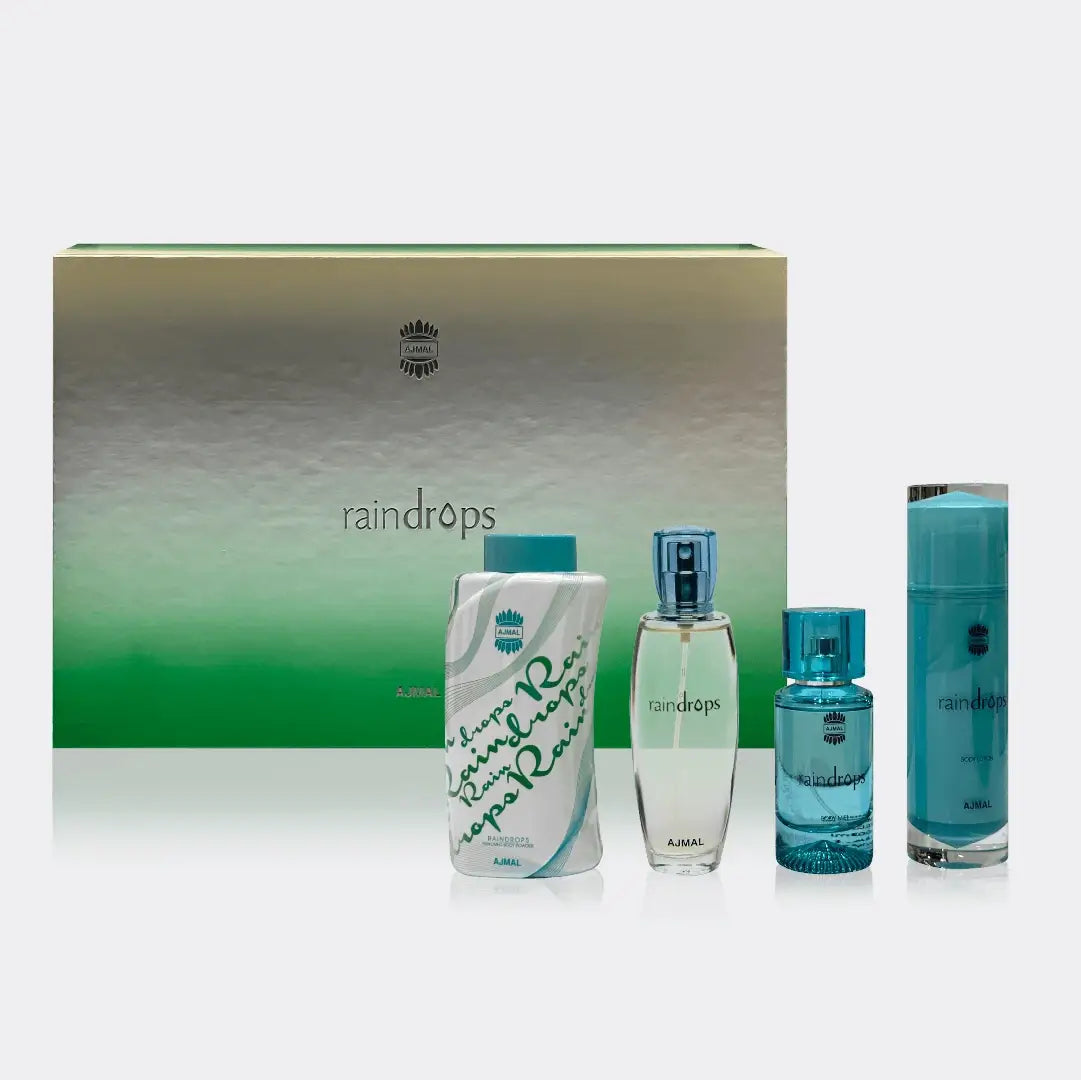 Set of 'raindrops' perfume bottles and packaging on a white background with Ajmal branding