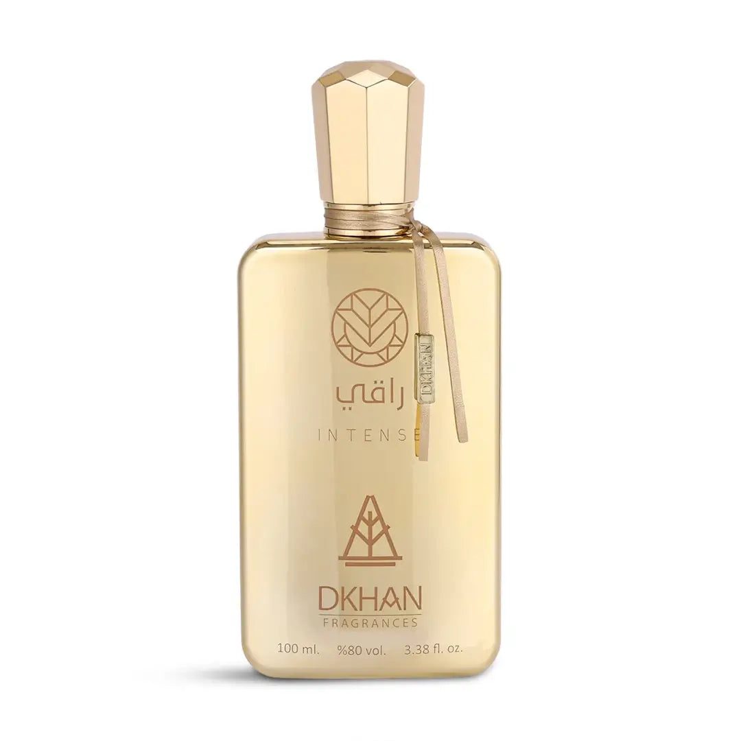 'Raqi Intense' Gold perfume bottle with 'DKHAN' branding on a white background