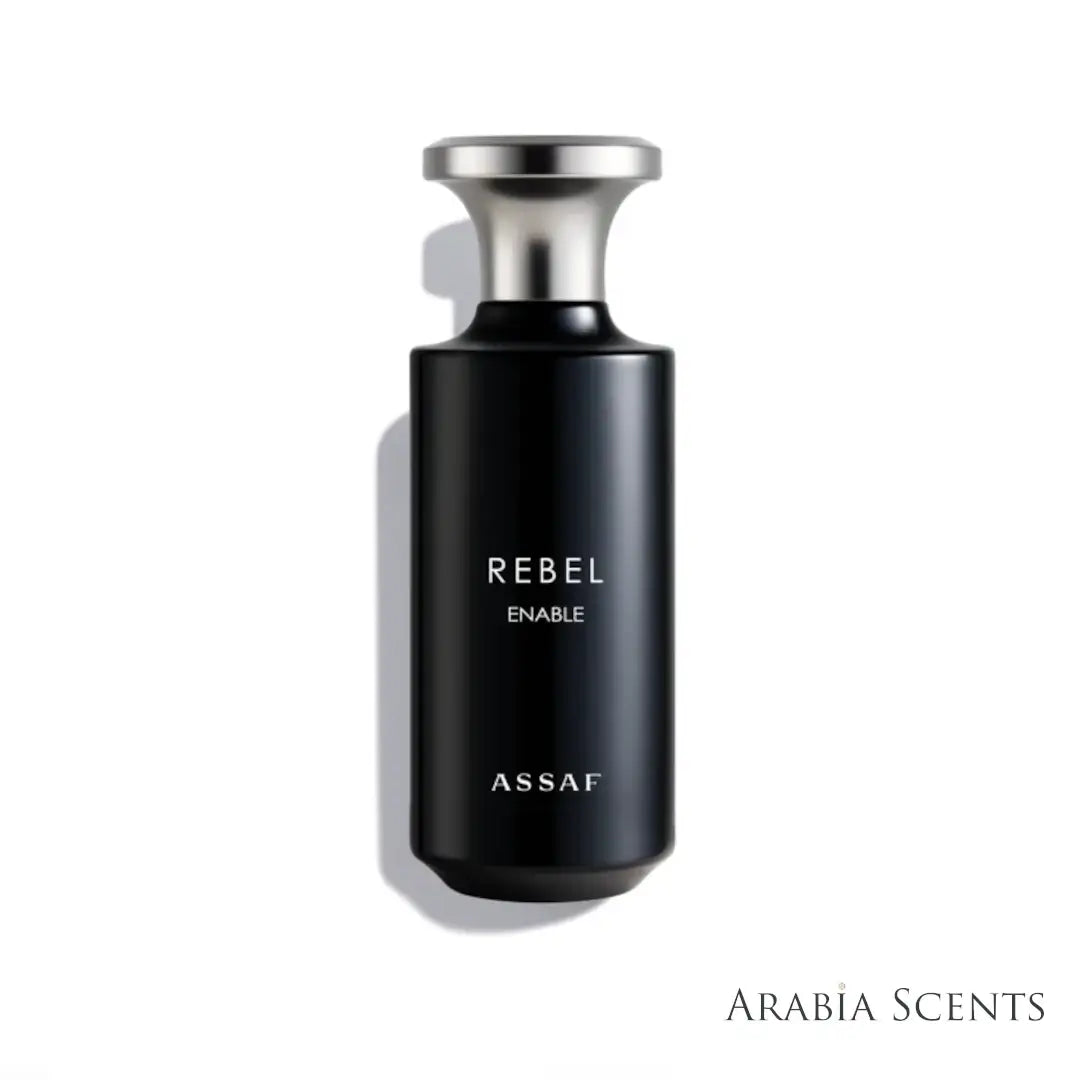 Black perfume bottle with silver cap labeled 'Rebel Enable' by 'Assaf' perfumes on a white background featured by 'Arabiascents'