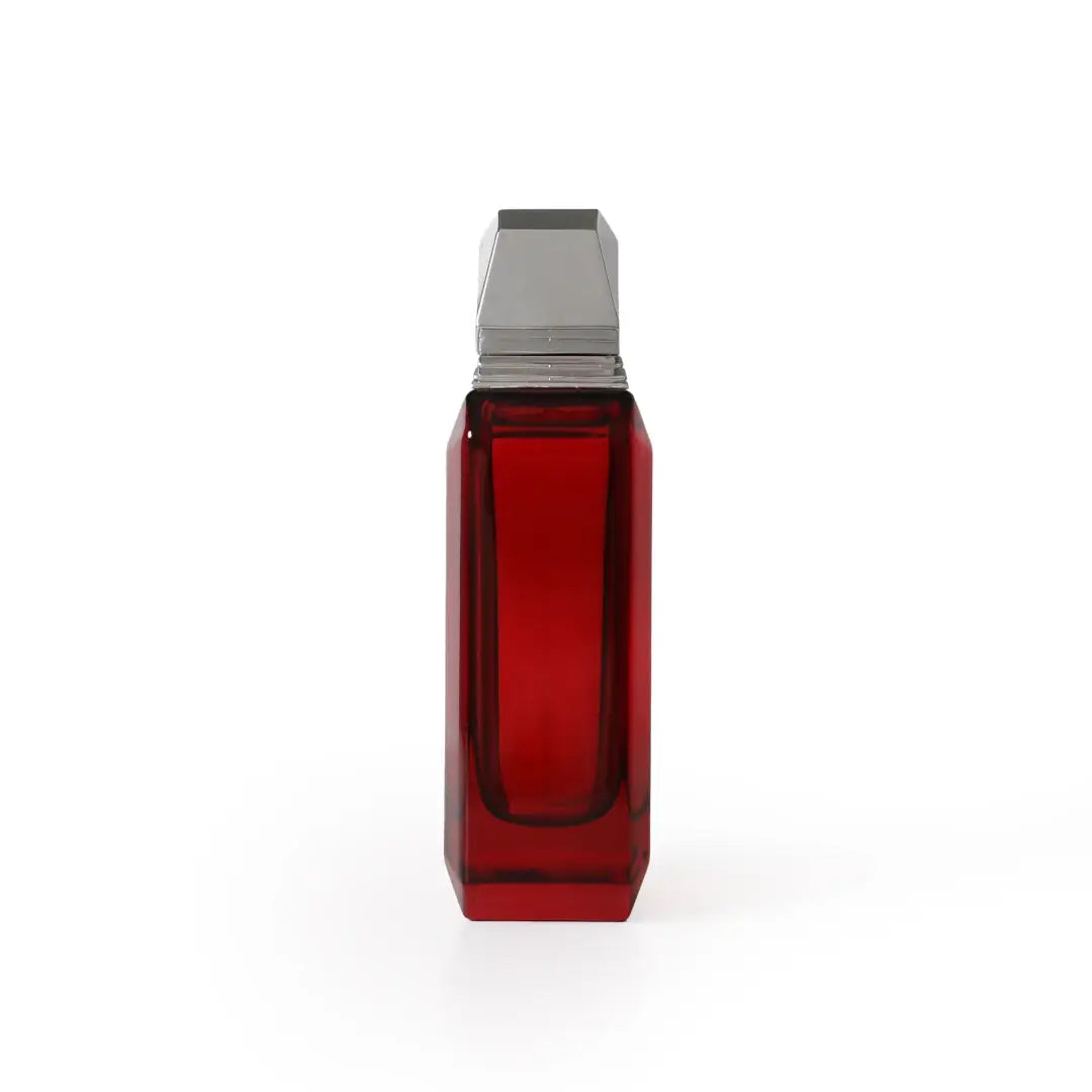 'Remember Me Red' perfume bottle with silver base on a white background by Atyab Al Sheikh