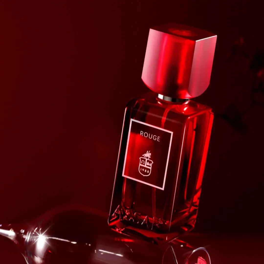 'Rouge' perfume bottle on a white background with 'Assaf' branding