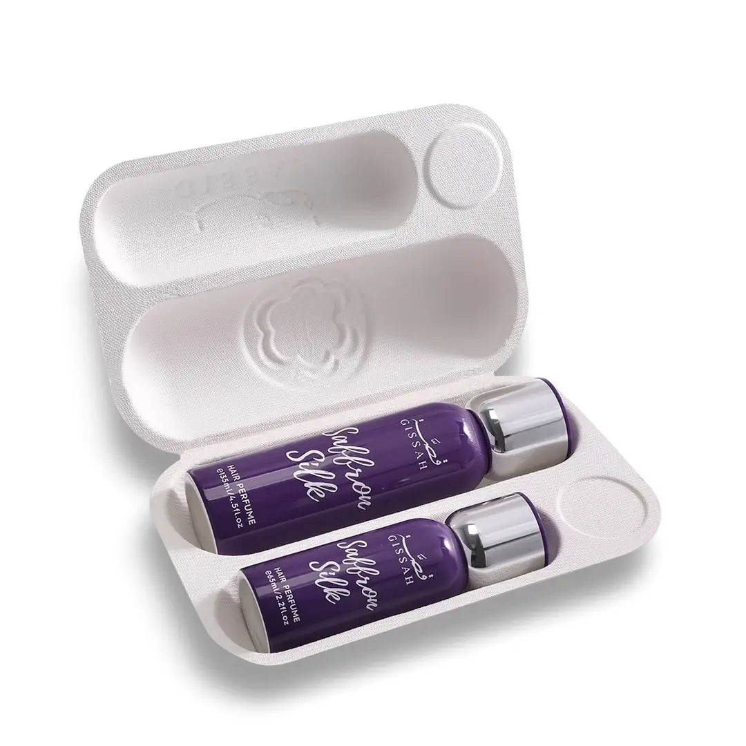 Two purple bottles of Gissah Saffron Silk hair Mist in a white tray on a white background