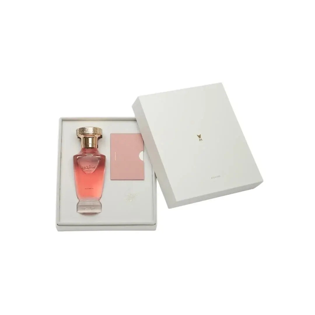 'Sahara Rose' Perfume bottle and pink box in a white box on a white background with Al Majed Oud branding