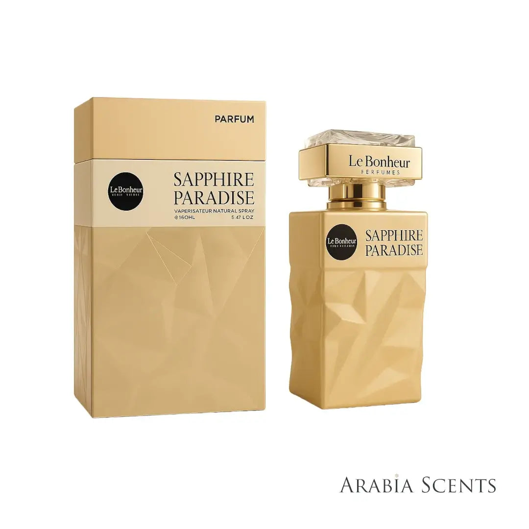 'Sapphire Paradise' Gold perfume bottle and packaging with 'Le Bonheur' branding on a white background featured by ArabiaScents