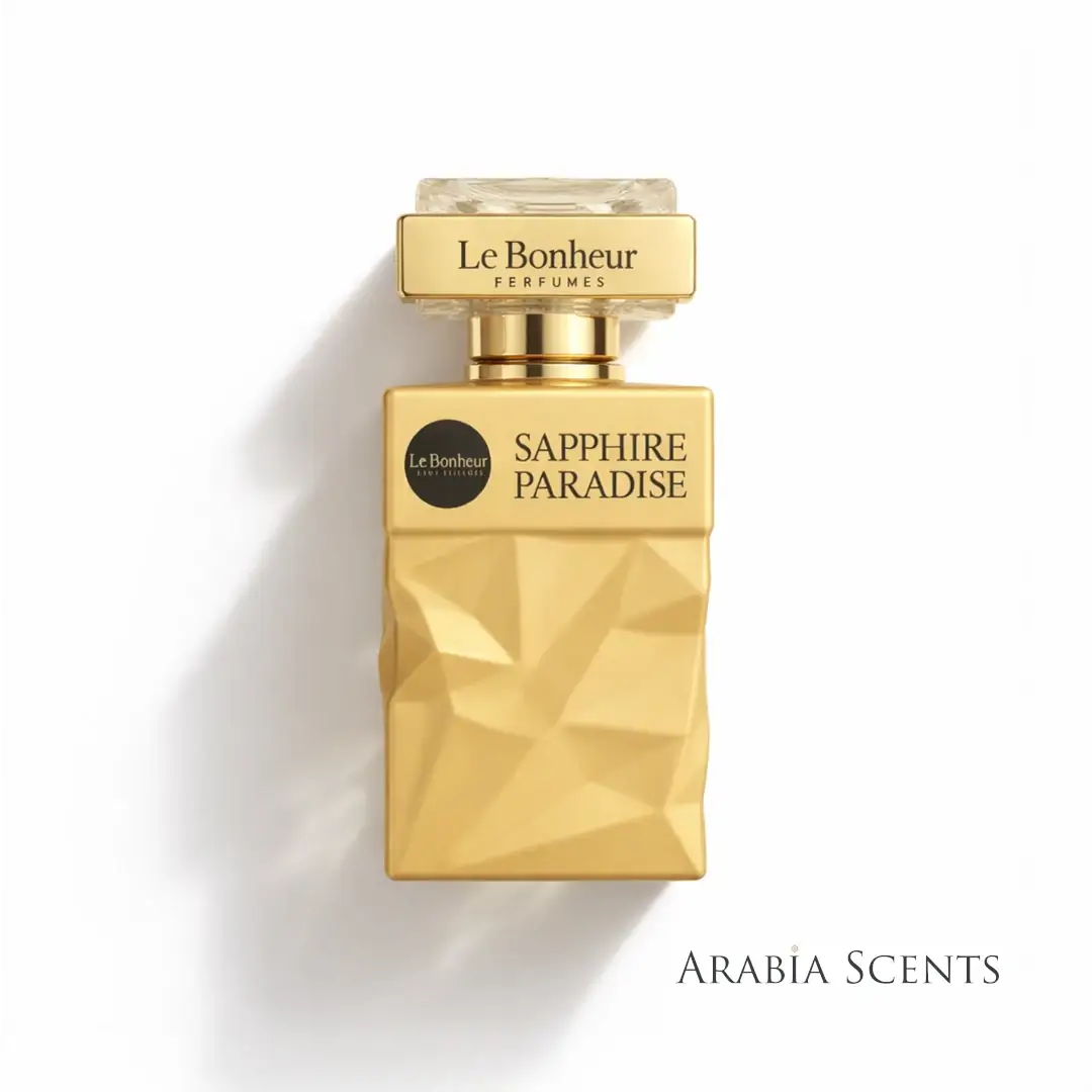 'Sapphire Paradise' Gold perfume bottle branded 'Le Bonheur' on a white background featured on ArabiaScents