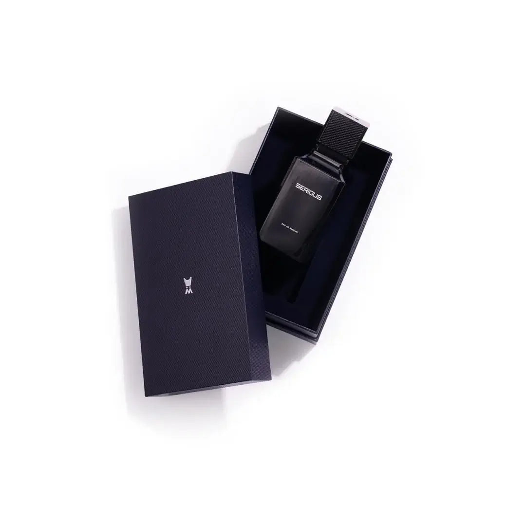 Blue perfume bottle and packaging  'SERIOUS' eau de parfum on a white background branded Al Majed Oud