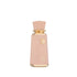 Sweet Paradise by French Avenue Pink perfume bottle with gold accents on a white background