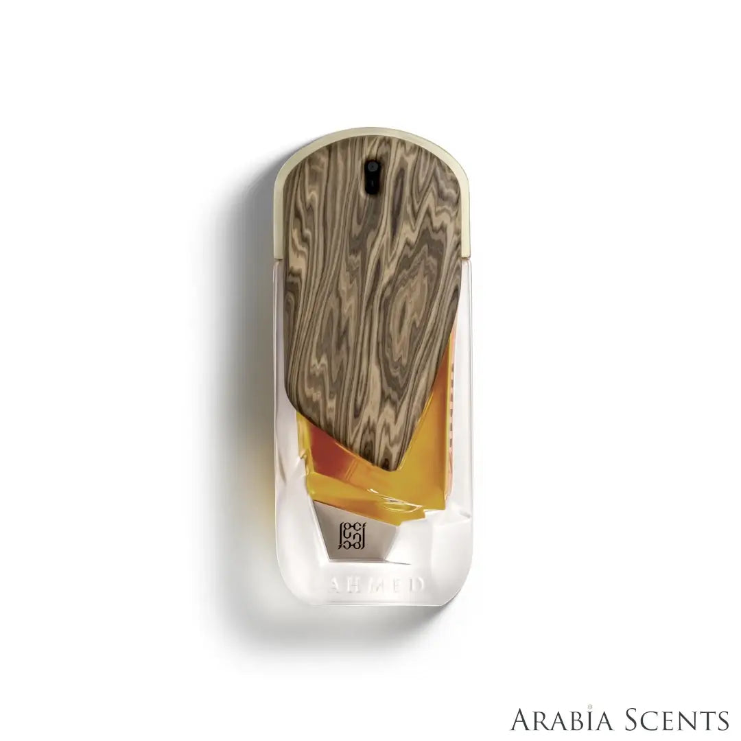 'The Roots 2000' perfume bottle on a white background with 'Ahmed Al Maghribi' branding featured by 'Arabiascents'