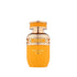 Tropical Kiss Orange perfume bottle with gold cap on a white background  branded French Avenue