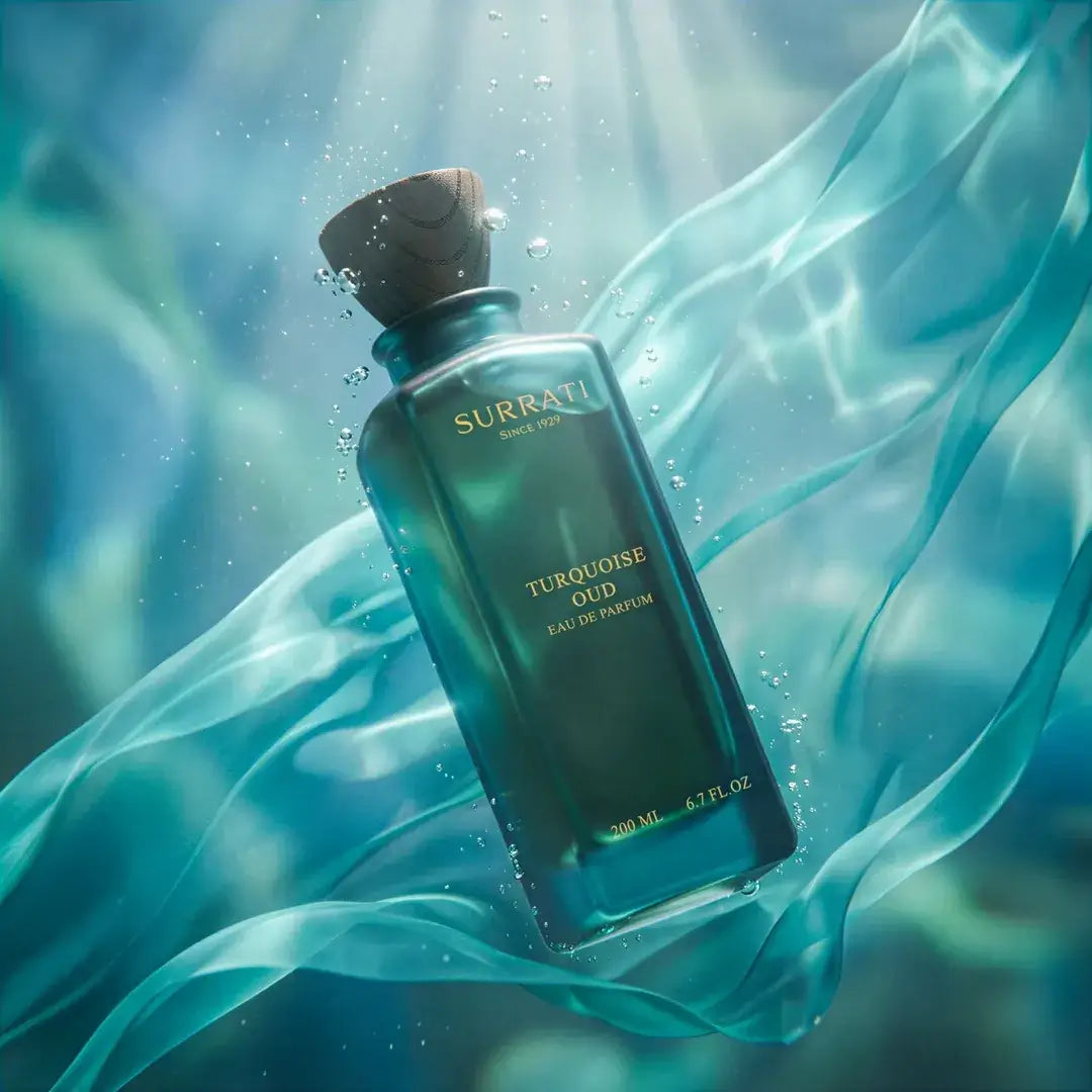 Surrati Turquoise Oud perfume bottle with a flowing fabric background