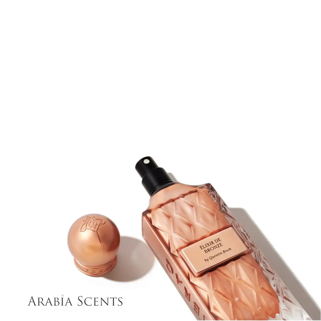 Elixir De Bronze perfume by IBRAQ on a white background featured by 'ArabiaScents'