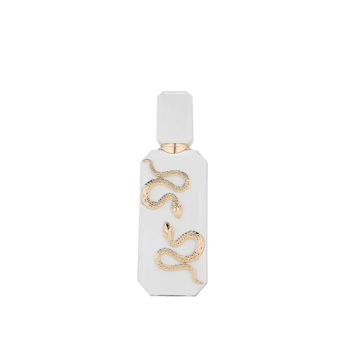 Veneno Bianco Perfume bottle with gold snake design on a white background by French Avenue