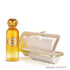 Volt by Gissah fragrance bottle in amber glass next to its beige presentation box with gold trim, on a white background featured on 'ArabiaScents'